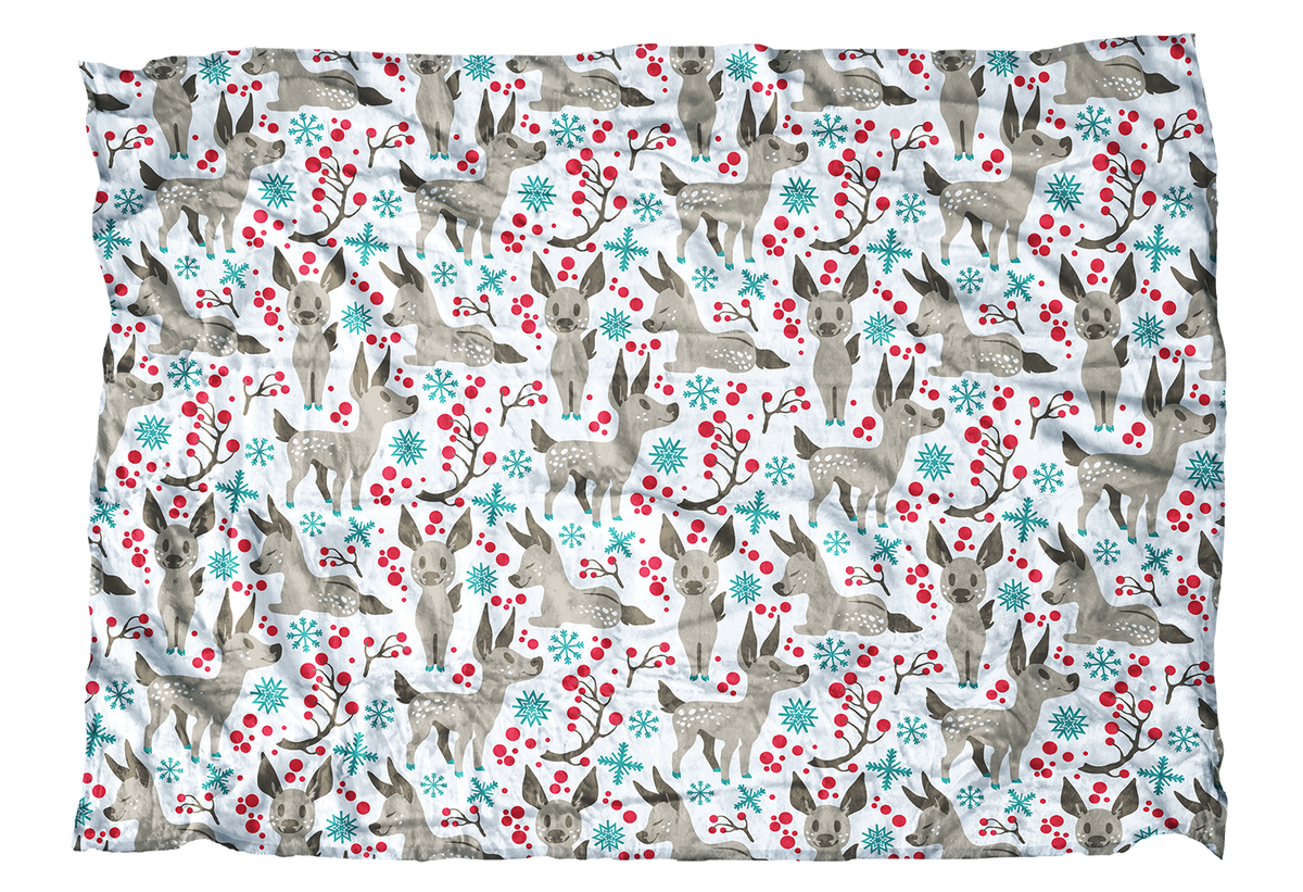 These fawns are ready for their first winter! This baby deer blanket with blue accents is sweet addition to your winter decor.