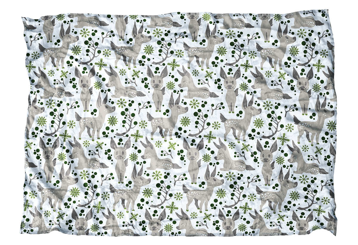 These fawns are ready for their first winter! This baby deer blanket with green accents is sweet addition to your winter decor.